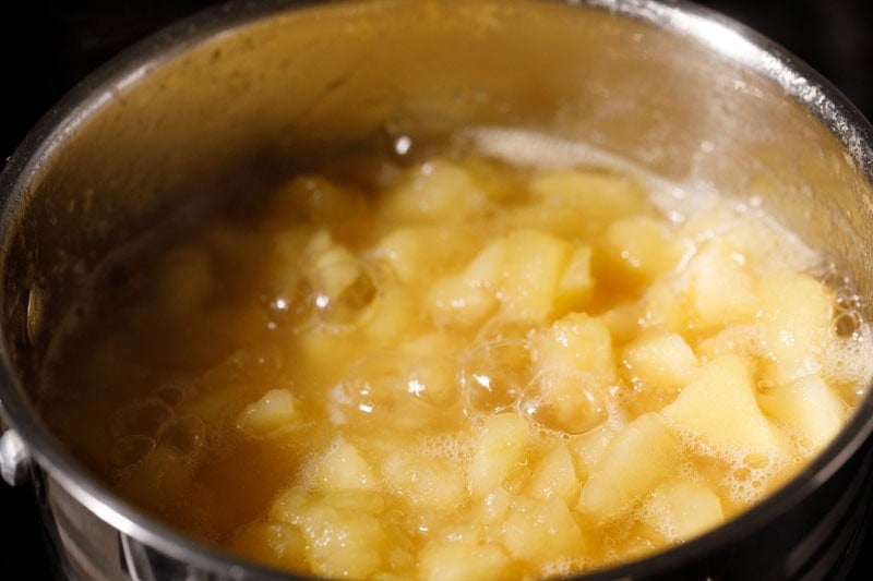 Softened apples in pan.