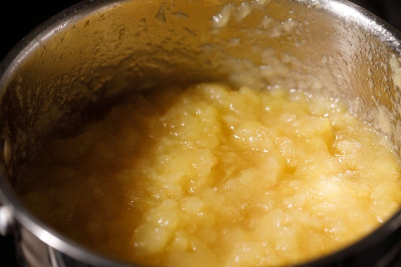 Mashed apples in pan.