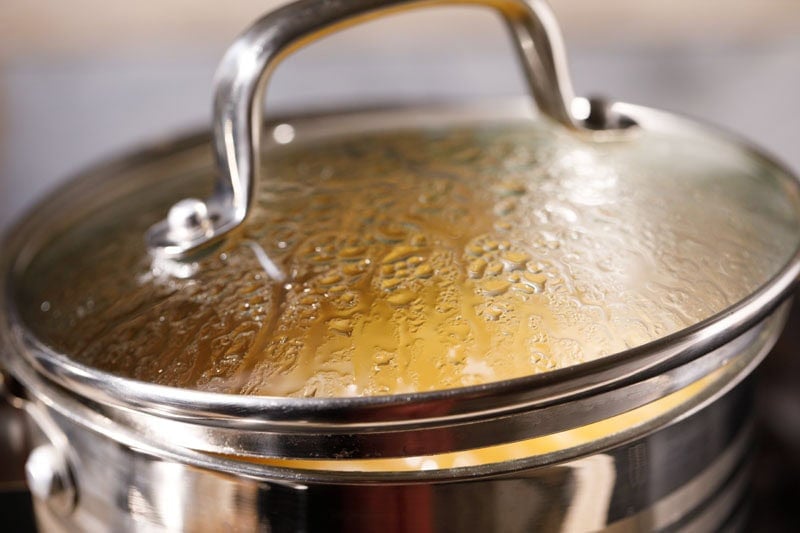 Pan covered partly with lid.