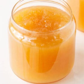 Apple jam in a glass jar.