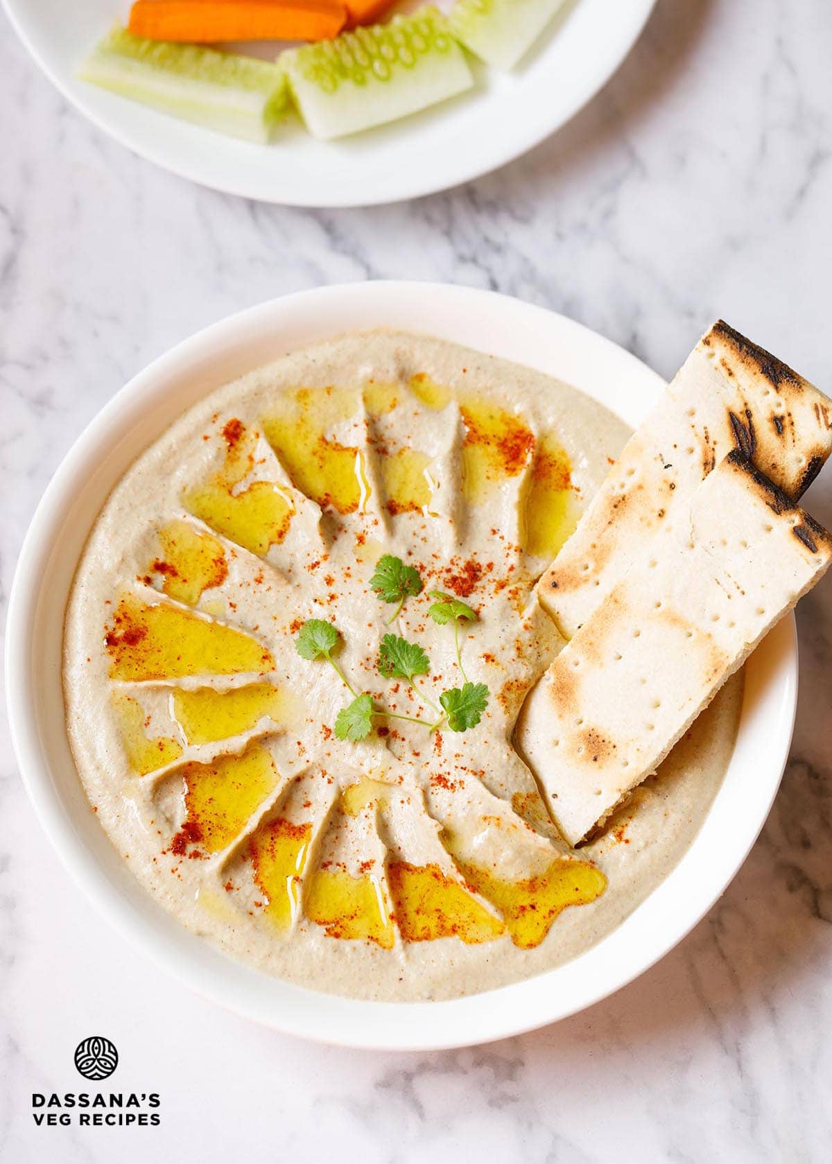 Creamy baba ganoush dip with pita and vegetables.
