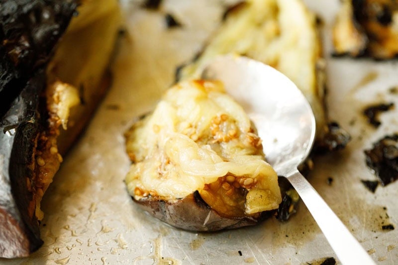 Roasted eggplant with spoonful taken.
