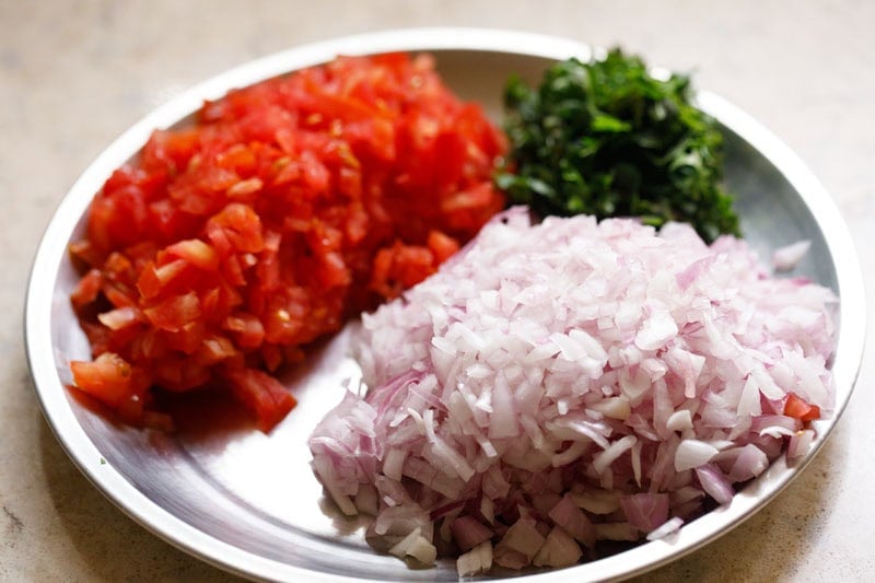 Chopped tomatoes, onions, and cilantro.