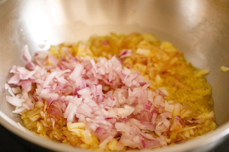 Chopped onions sautéing in pan.