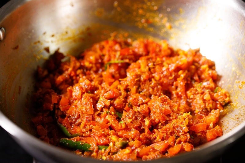 Spiced tomato mixture in pan.