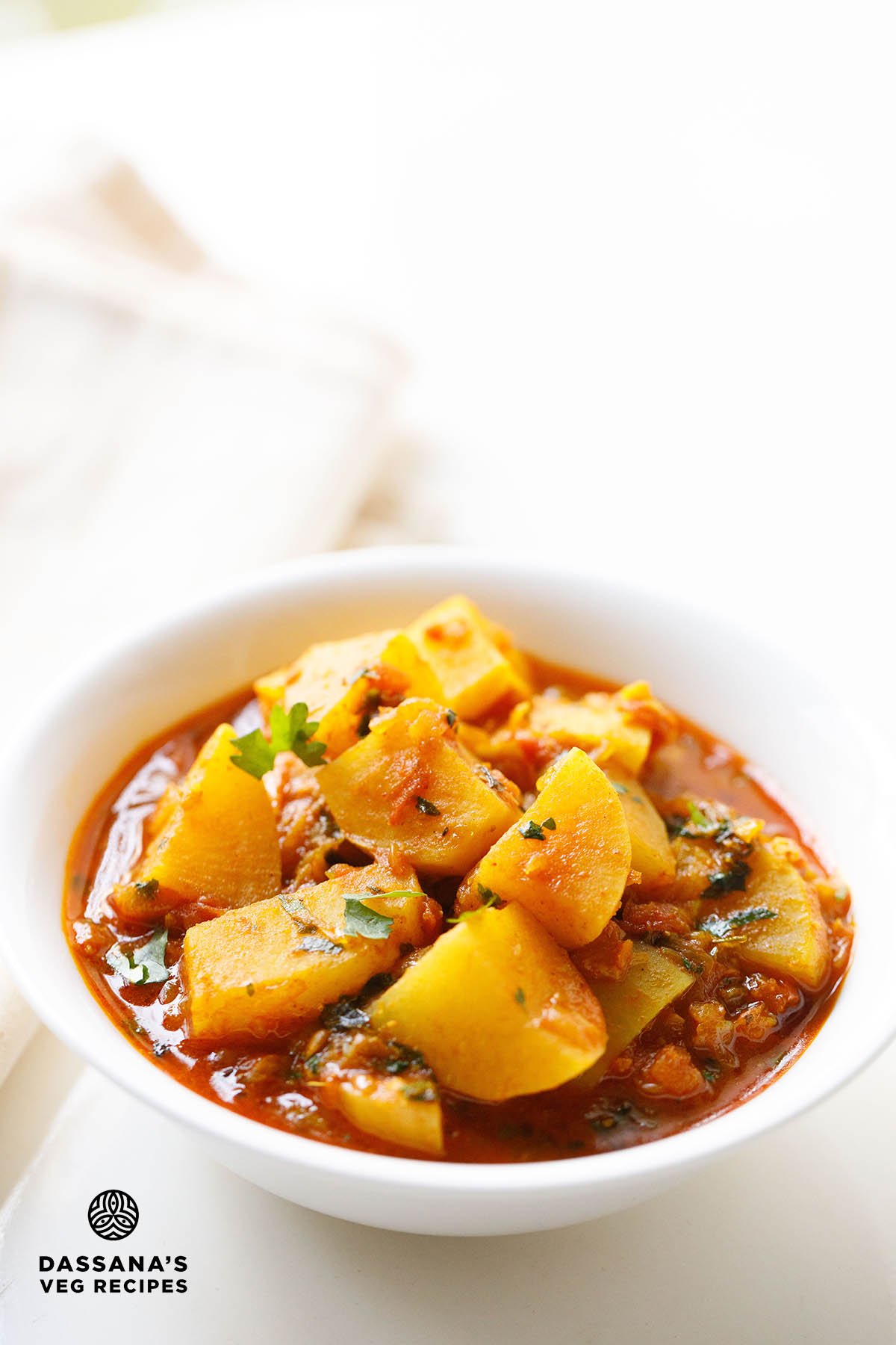 Indian turnip curry in white bowl.