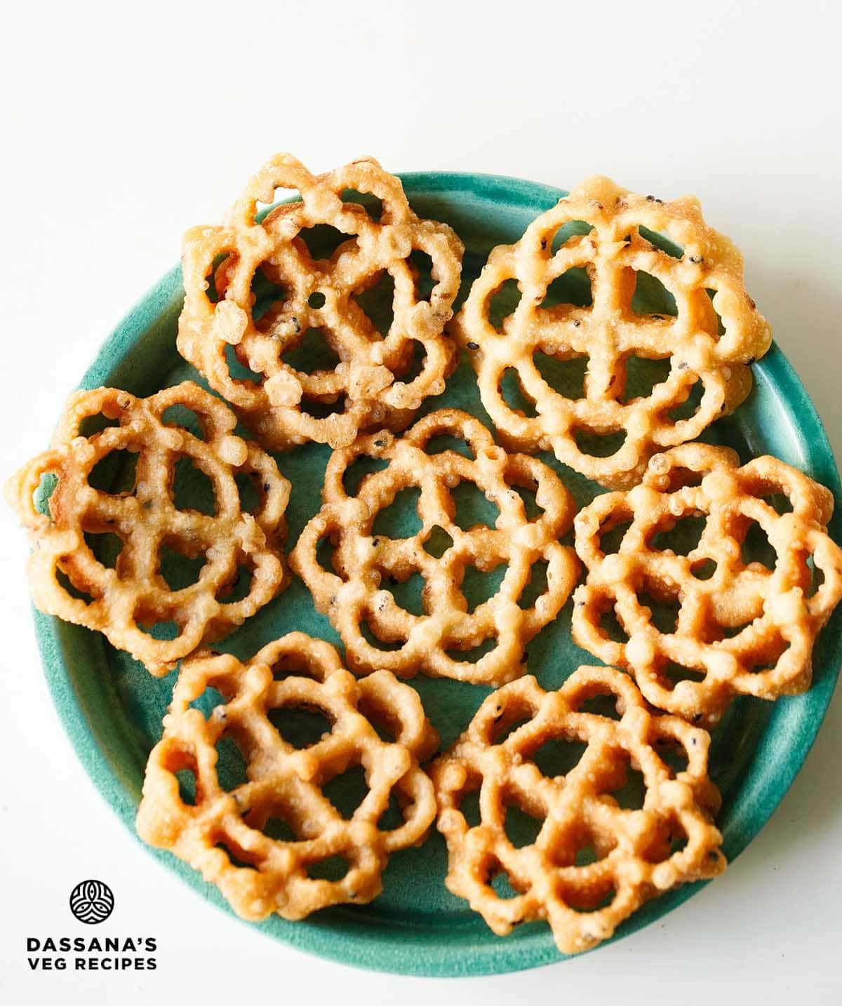 Decorative fried achappam or achu murukku on plate.