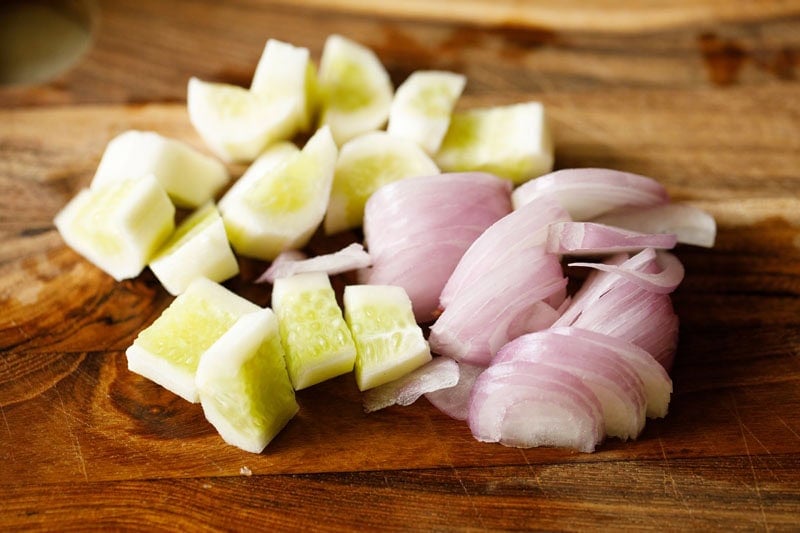Chopped cucumbers and sliced onions.