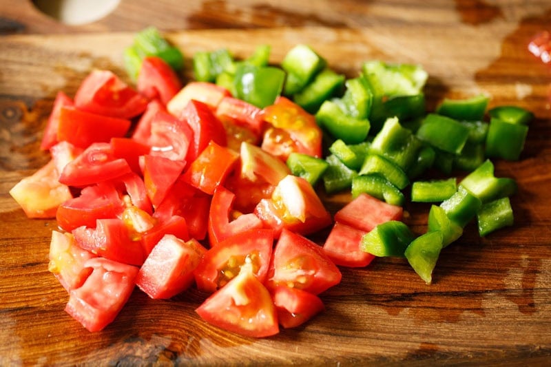 Chopped tomatoes and green bell peppers.