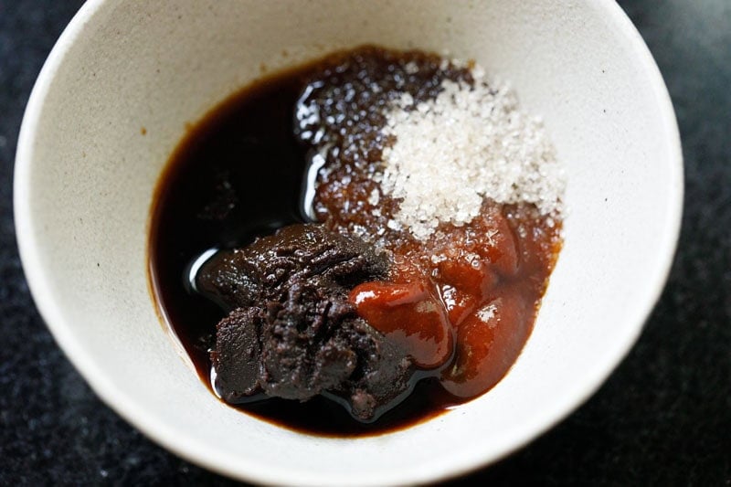 Bowl with sauce ingredients and seasonings.