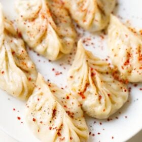 Steamed paneer moms with spicy seasonings.