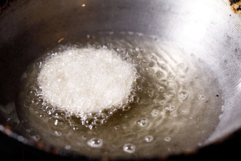 rose cookie or achu murukku frying in oil.