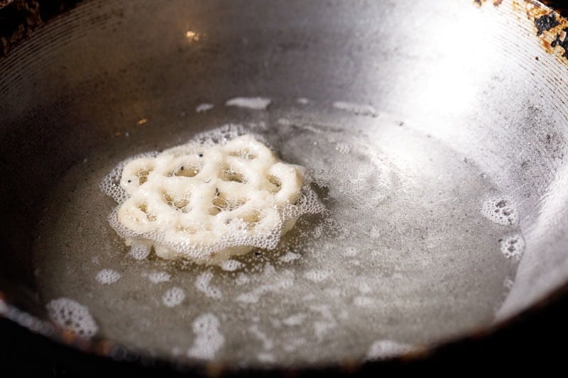 rose cookie frying in oil.