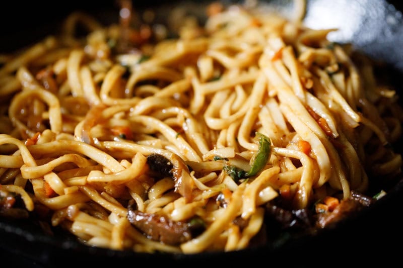 Stir-fried yaki udon noodles with vegetables and sauce.