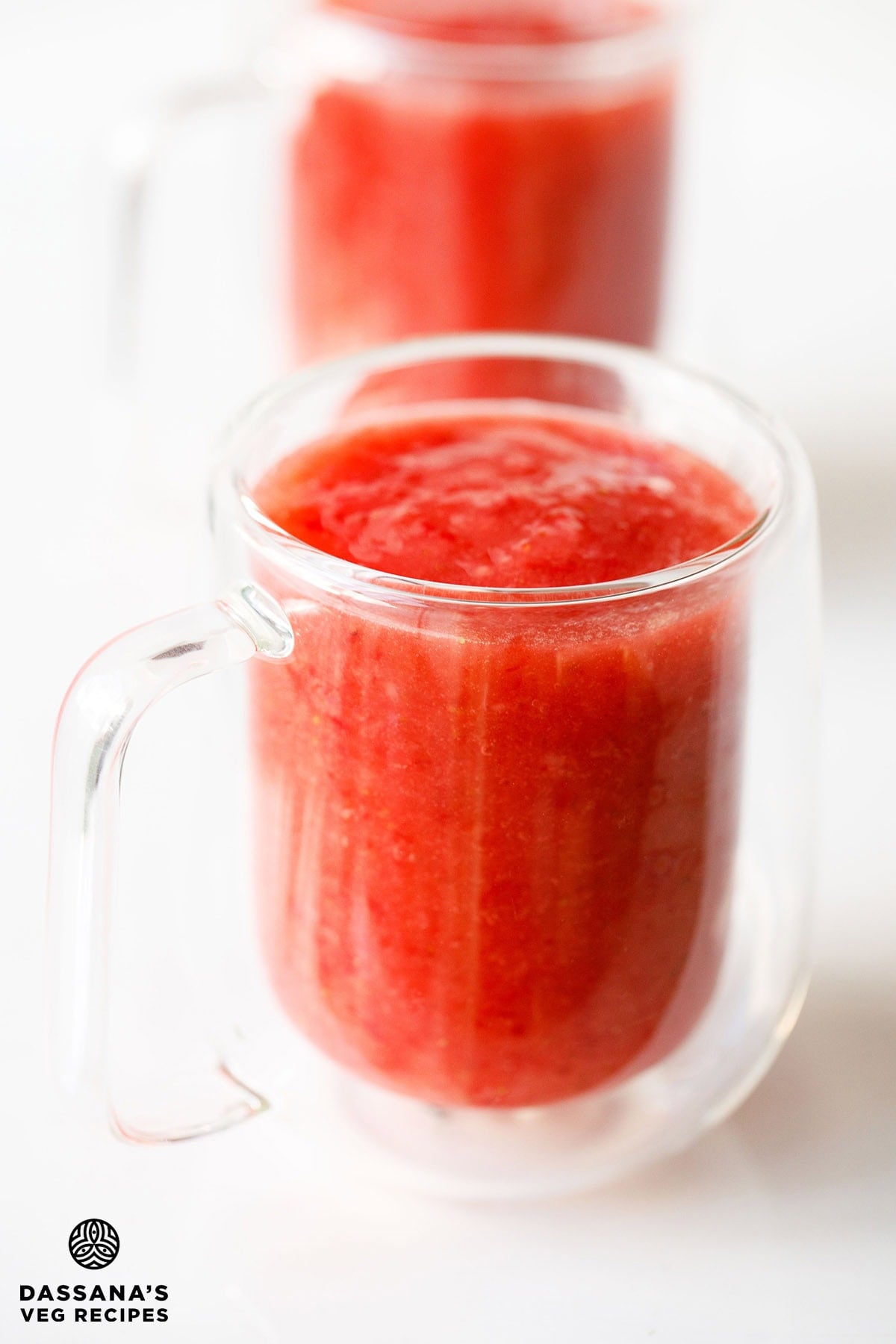 Fresh homemade strawberry juice in glass mugs