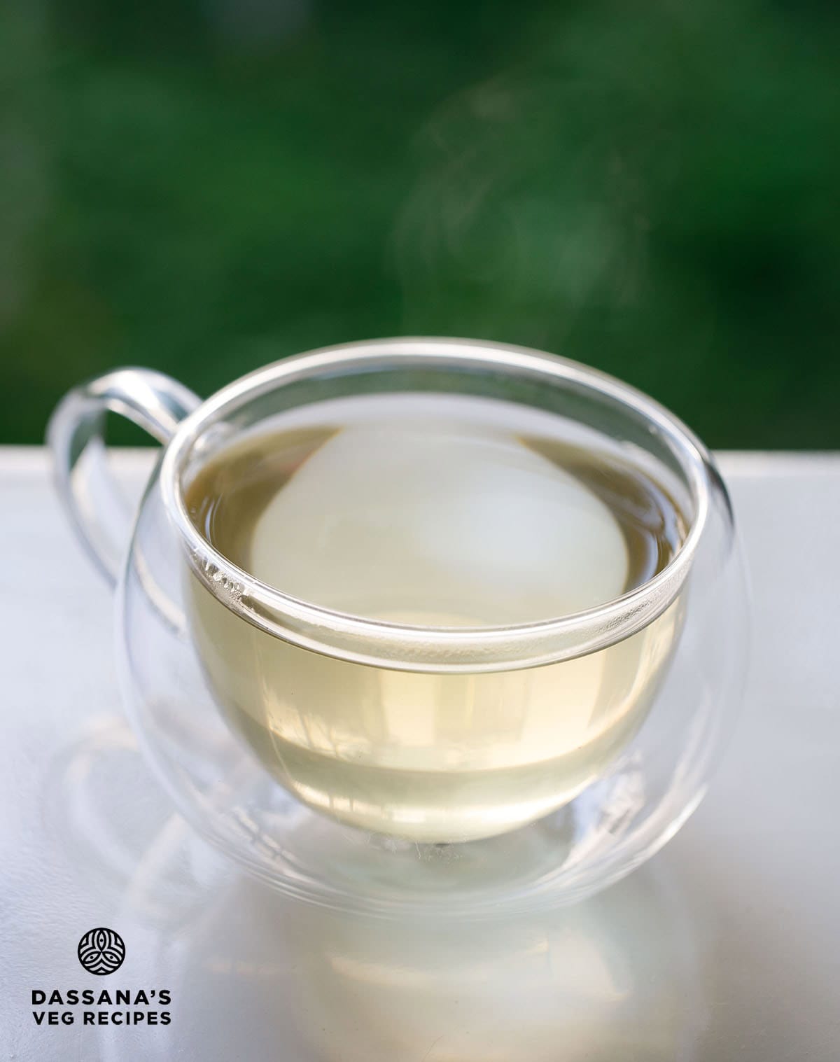 lemongrass tea in a transparent glass cup.