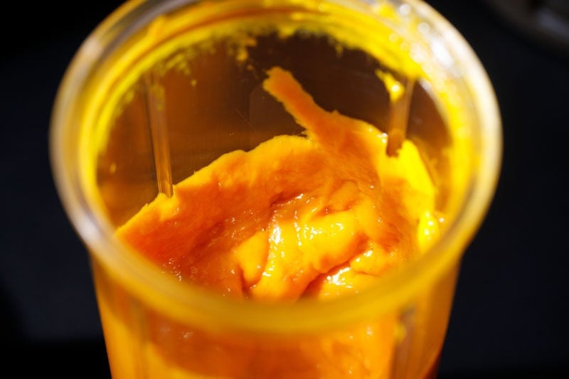 Thick, bright yellow mango puree.