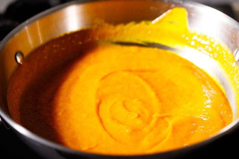Mango puree in pan simmering.