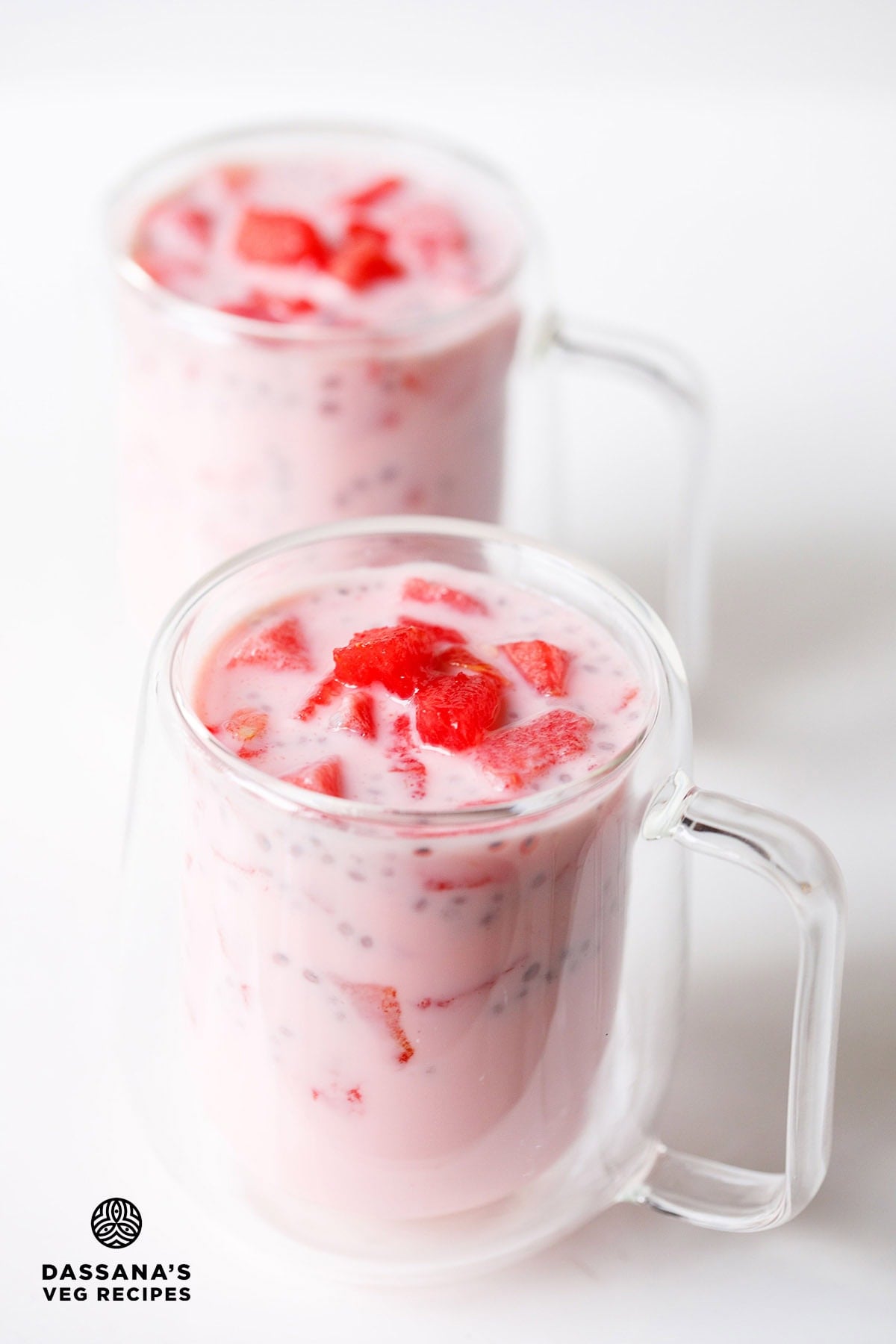 Mohabbat ka sharbat in two glasses topped with watermelon cubes.