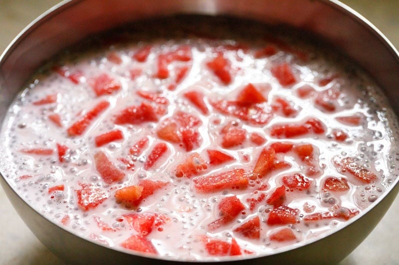 water melon cubes mixed with rose flavored milk to make mohabbat ka sharbat drink.
