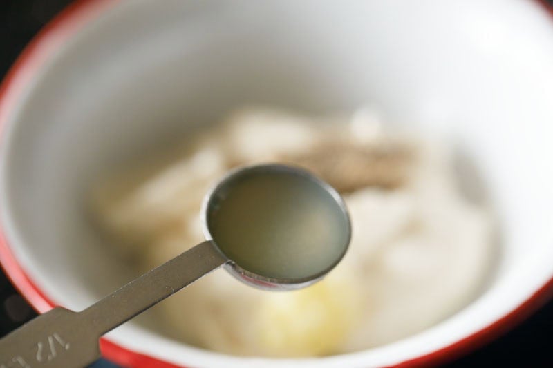 lemon juice in a measuring spoon.