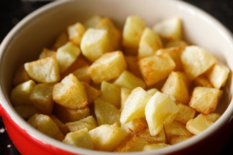 fried potatoes in a serving dish.