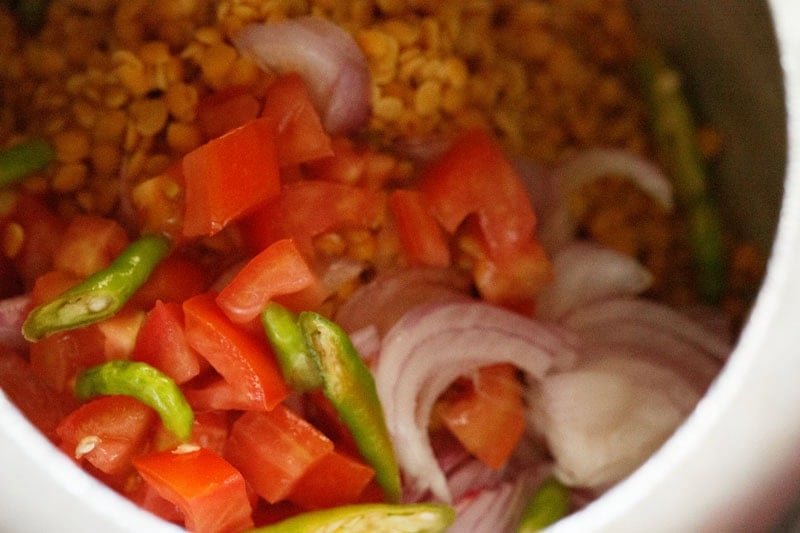Ingredients for toor dal preparation in cooker.