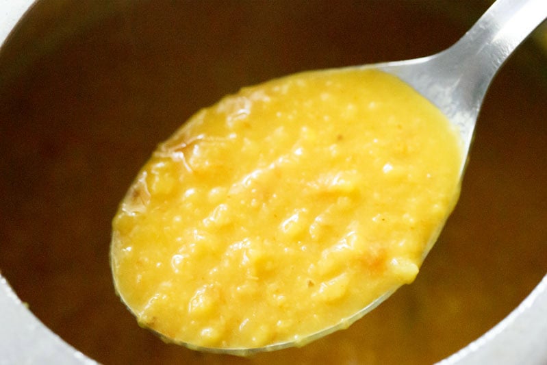 Spoonful of creamy cooked arhar dal or tuvar dal.