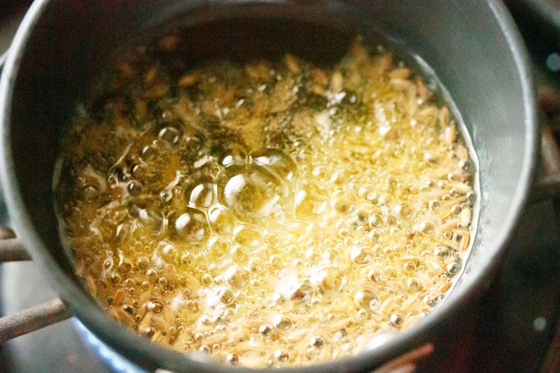 Cumin seeds crackling in pan.