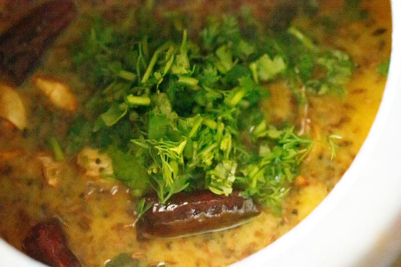 Cooked toor dal topped with fresh coriander.