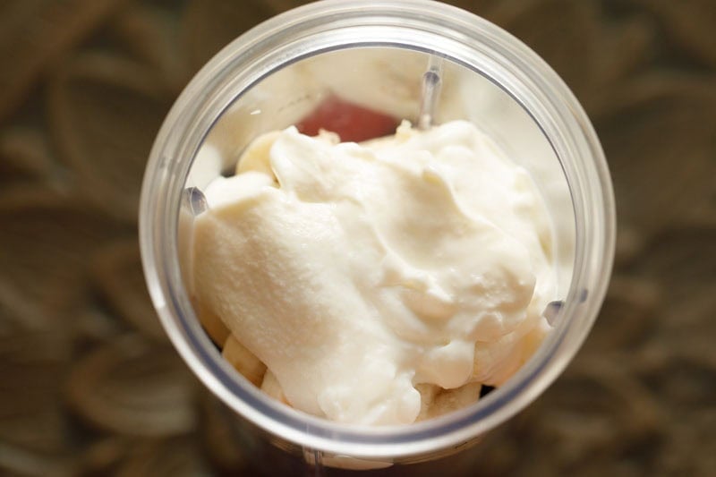 Creamy greek yogurt in blender cup.
