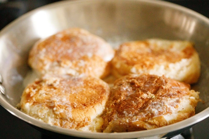 Golden brown butter buns in frying pan.