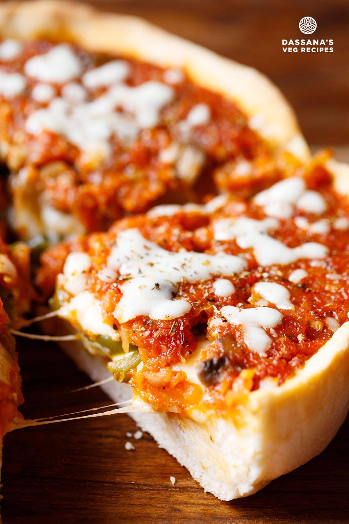 Cheesy, saucy, Chicago deep dish pizza slice.
