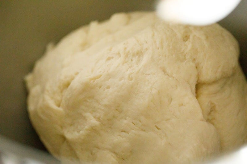 Deep dish pizza crust dough in a stand mixer.