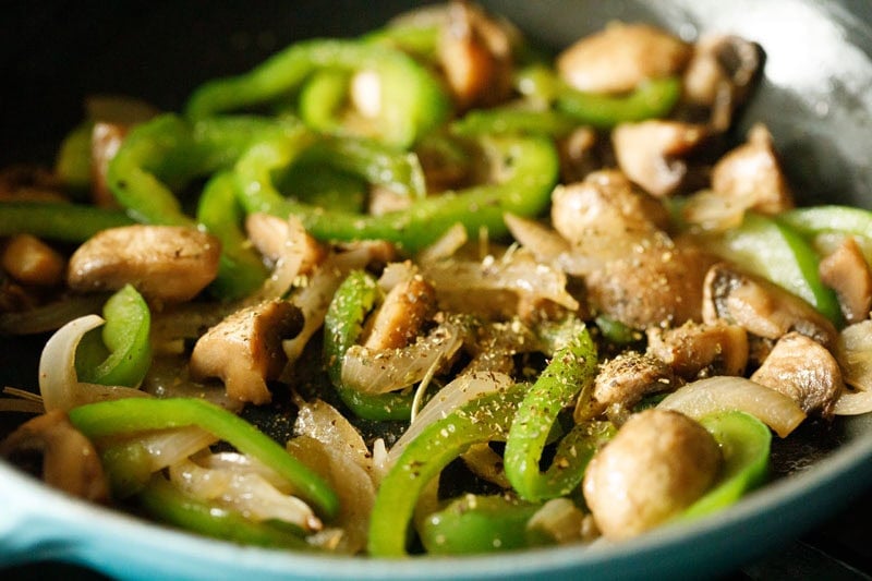 Sautéed mushrooms and green peppers sprinkled with dried herbs.