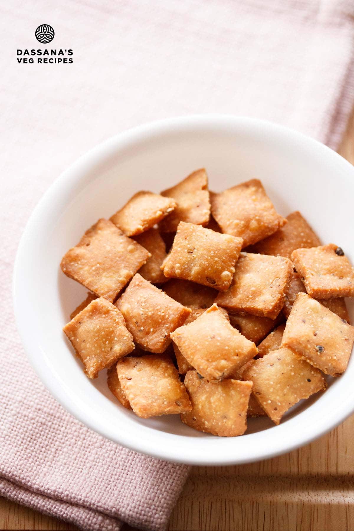 Diamond biscuits in a white bowl.