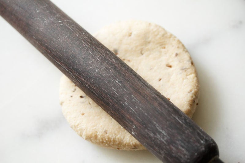 Rolling pin on top of dough.