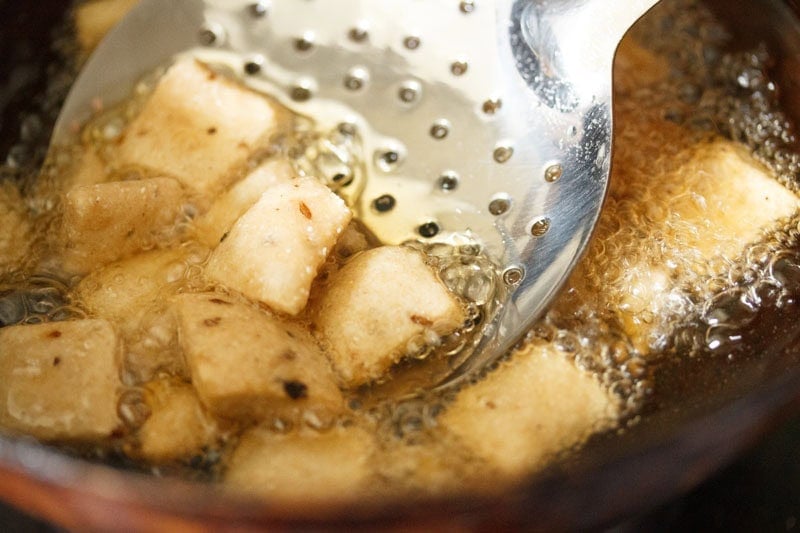 Maida biscuits in hot oil.
