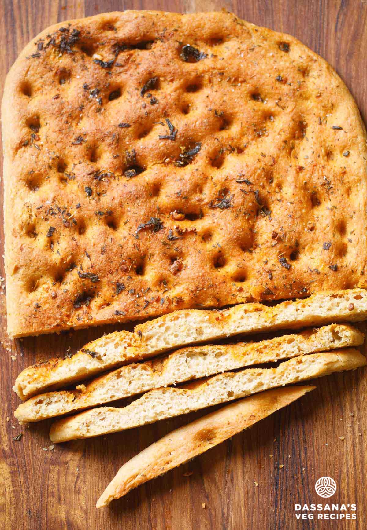 Freshly baked focaccia bread slices.