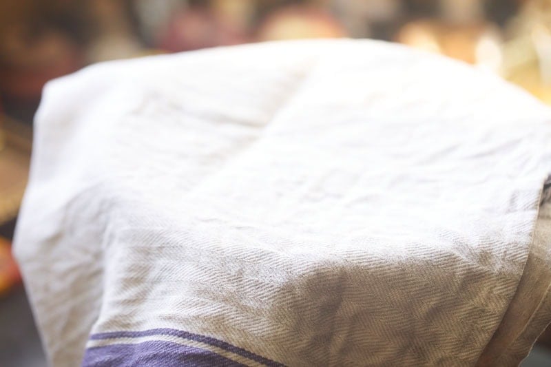 Covered bowl with textured cloth.