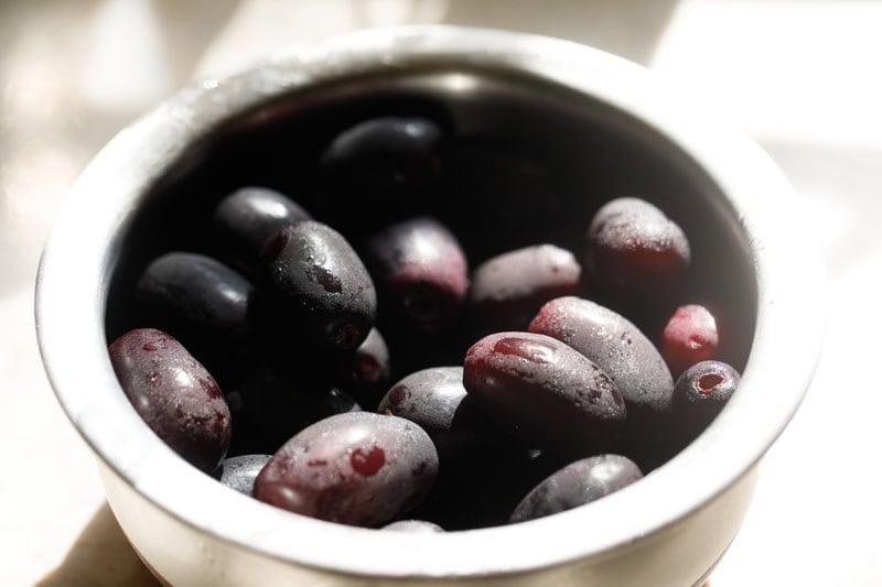 Fresh, plump, juicy Java Plums or Indian Jamuns in a bowl.