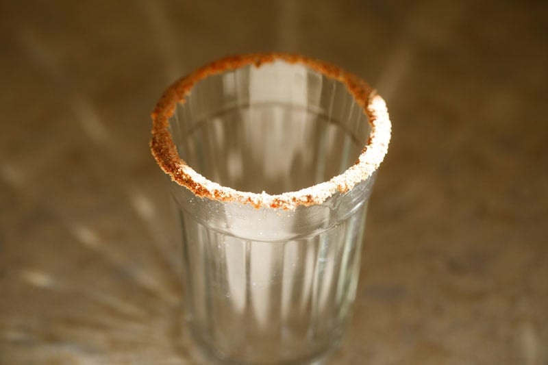 Salt and masala rimmed empty shot glass.