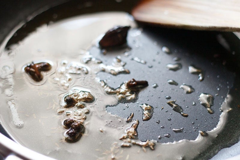 whole spices in oil.