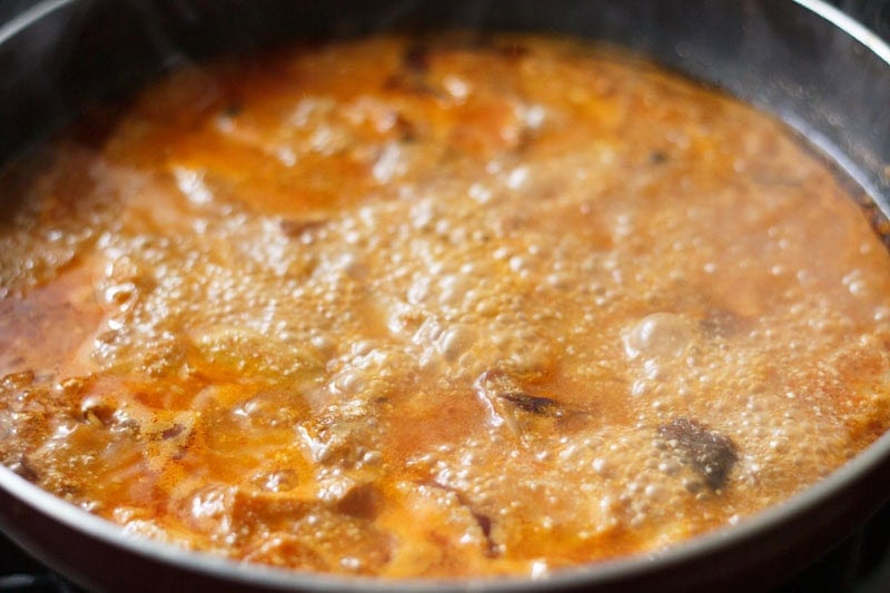 Kohlrabi curry simmering in pan.