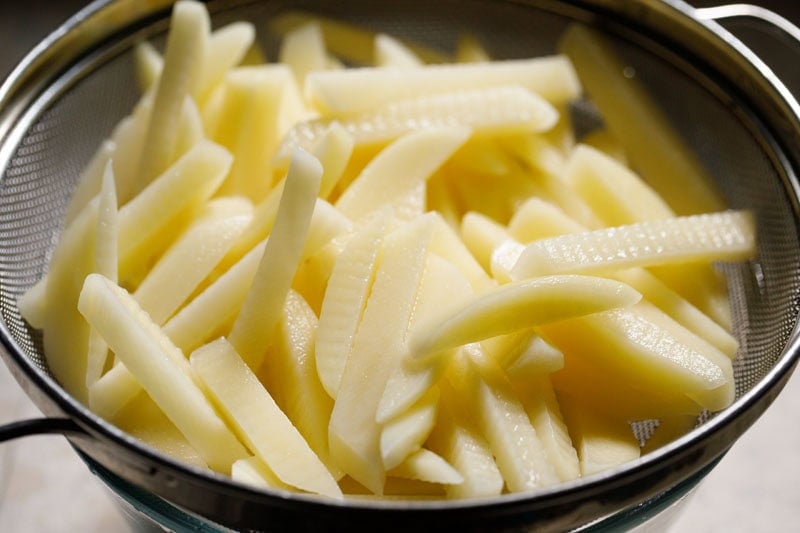 Fries in strainer.