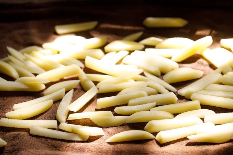 Fries spread on a cotton napkin to dry.