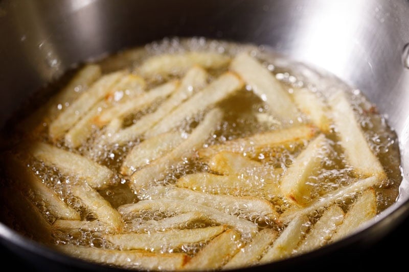 Fries again being fried in hot oil.