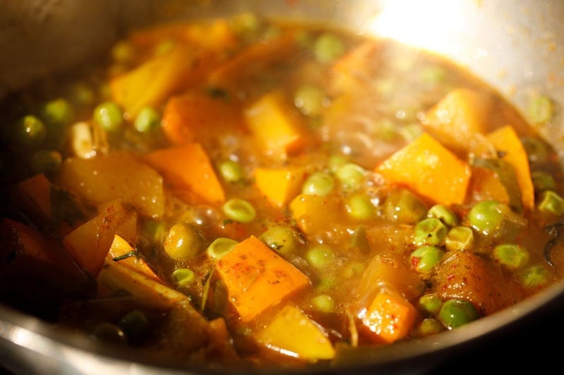 Colorful pumpkin curry in pan.