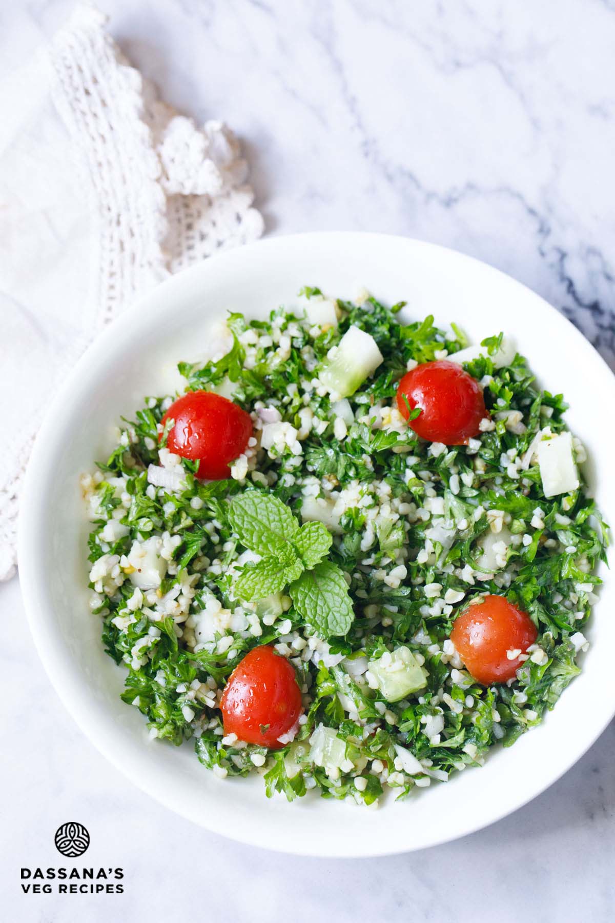 Fresh tabbouleh with tomatoes in a bowl.