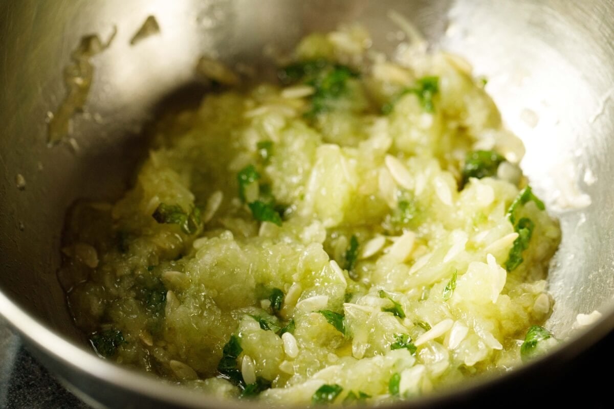 cucumber, mint and seasonings mixture in bowl.
